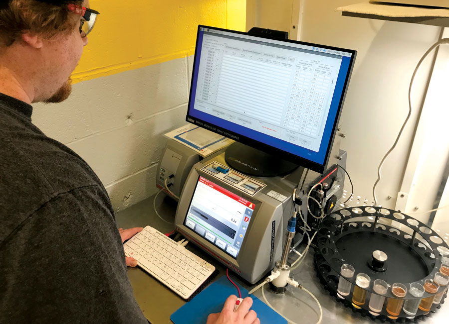 Man looking at data on computer screen