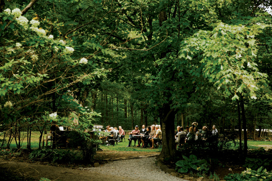 Group seated amongst trees