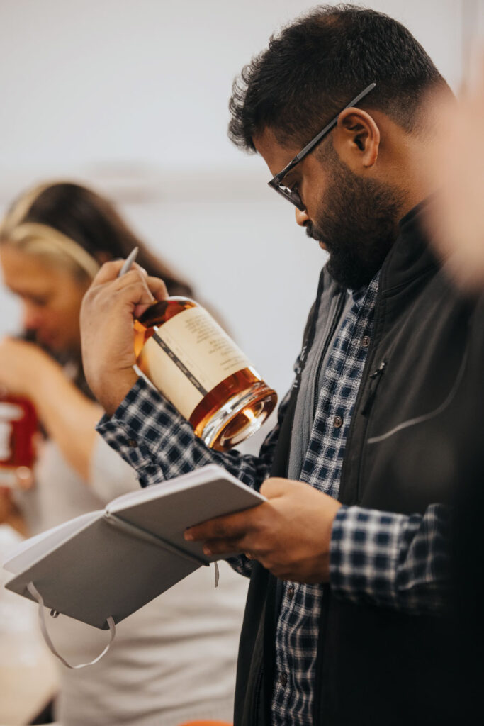 Man reading label on bottle