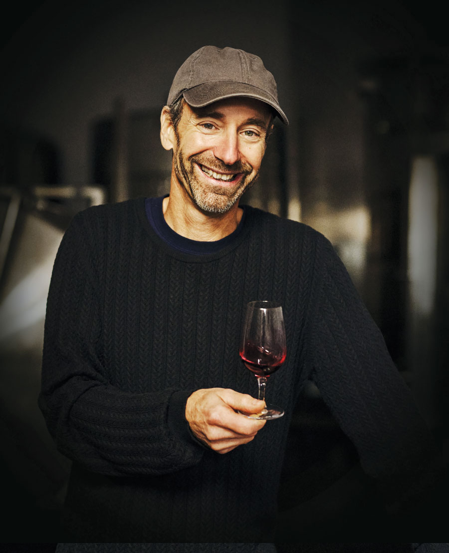 Stéphane Lamarre holding glass of wine