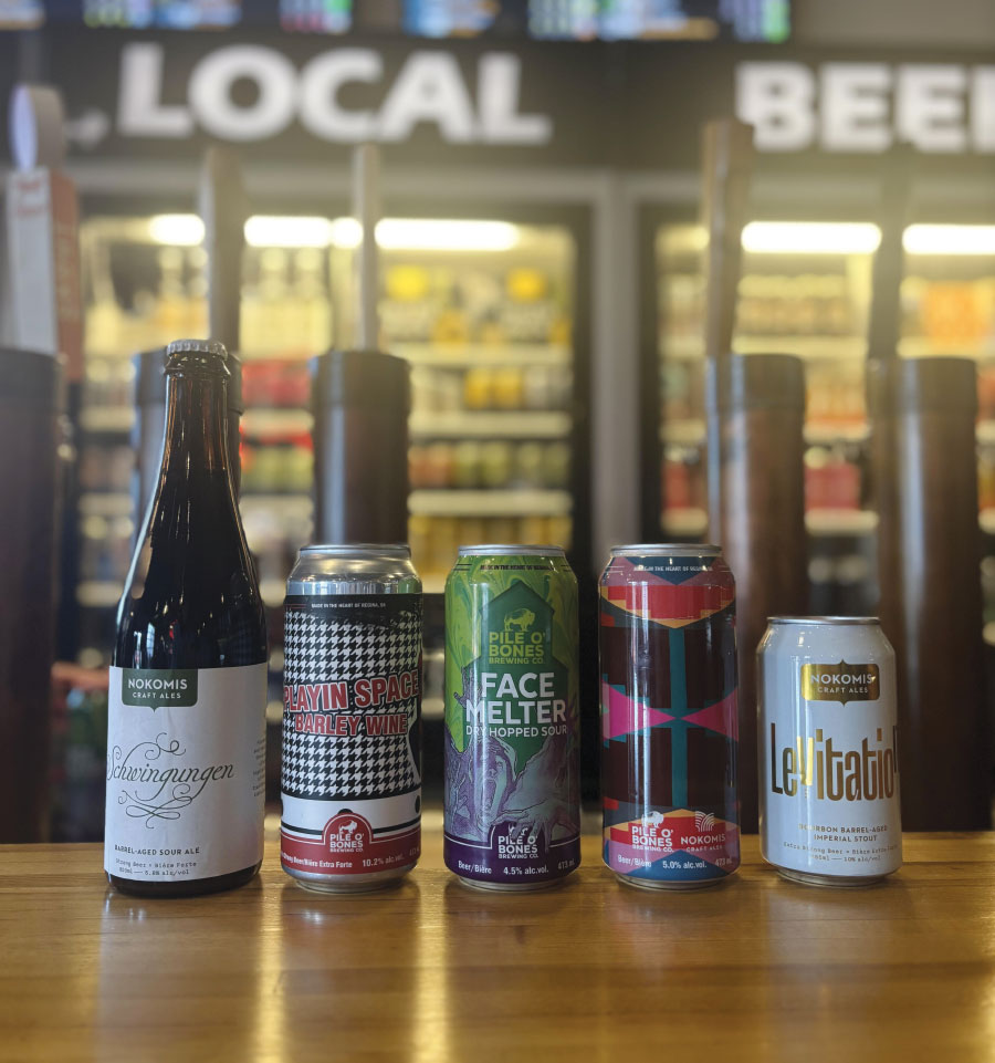 Lineup of various beers on counter