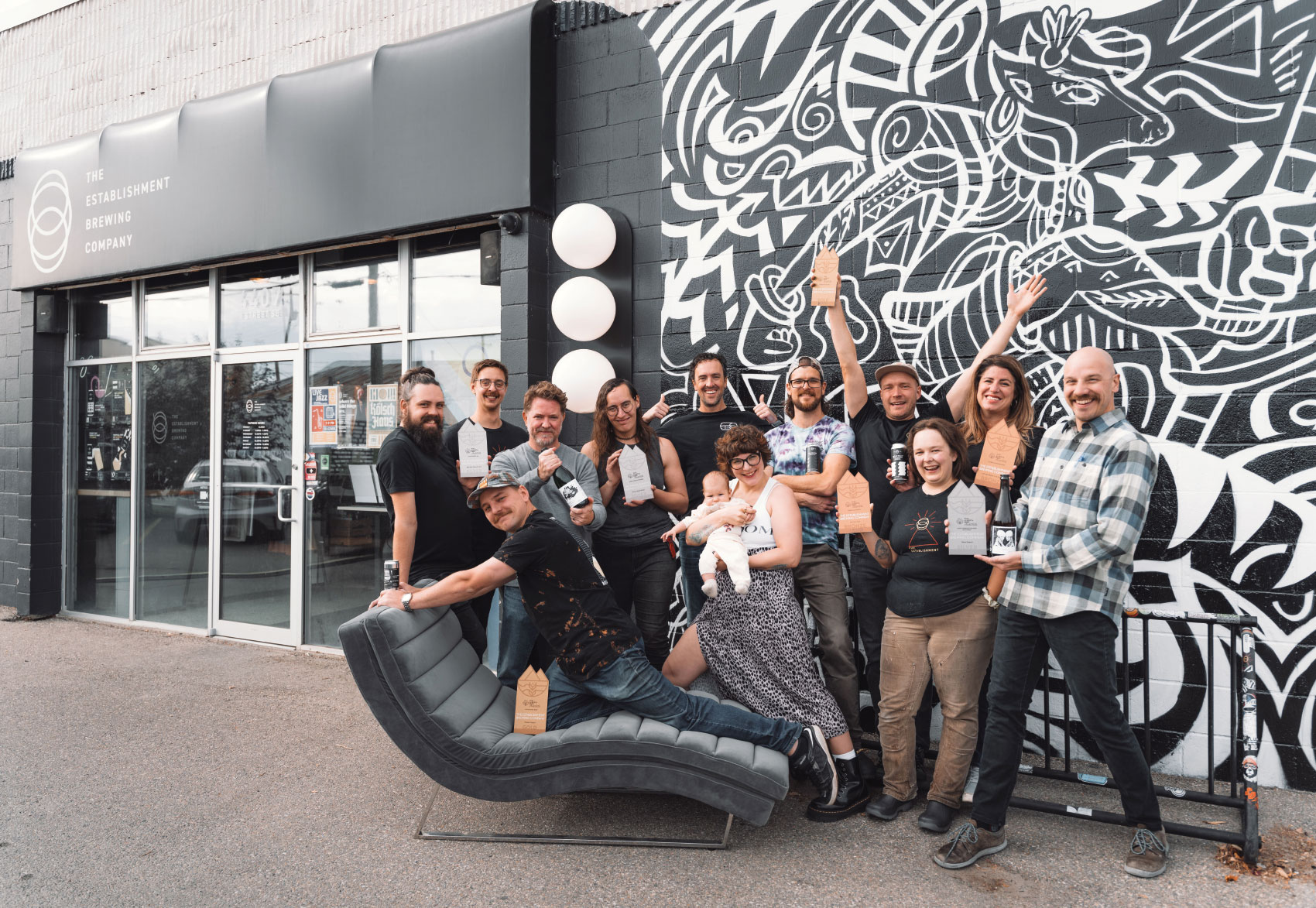 The Establishment Brewing Company team posing for group photo in front of brewery exterior