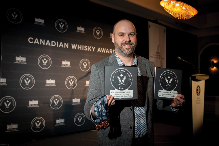 Brennan Colebank holding two awards