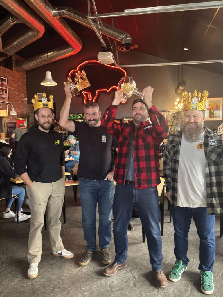 Group photo holding trophy